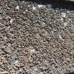 asphalt shingles missing granules a worn out roof with missing granules on asphalt shingles