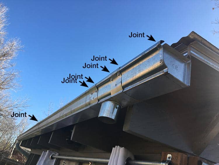 a pre-cut sectional gutter system on a small building