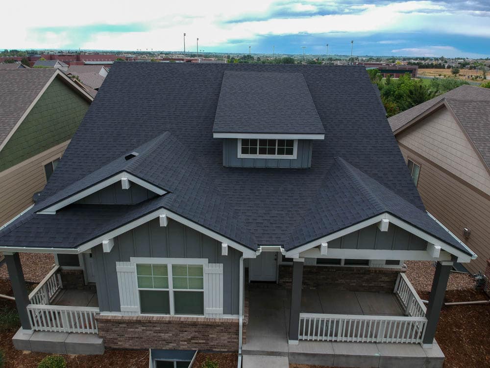 an aerial view of a new asphalt shingle roof on a house in Greeley Colorado