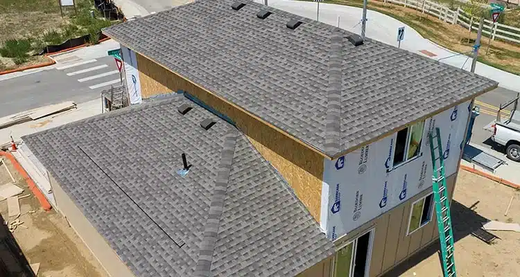 a new asphalt shingle roof on a new home construction