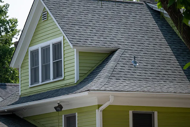 an asphalt shingle roof with curves