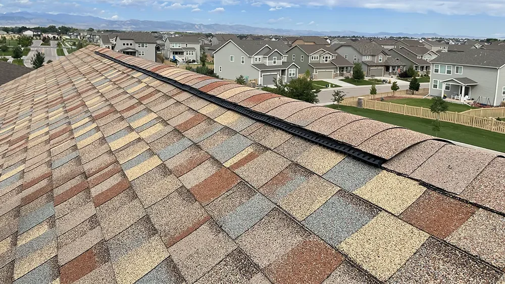 new roof shingles on home in Timnath, CO, with rocky mountains in background