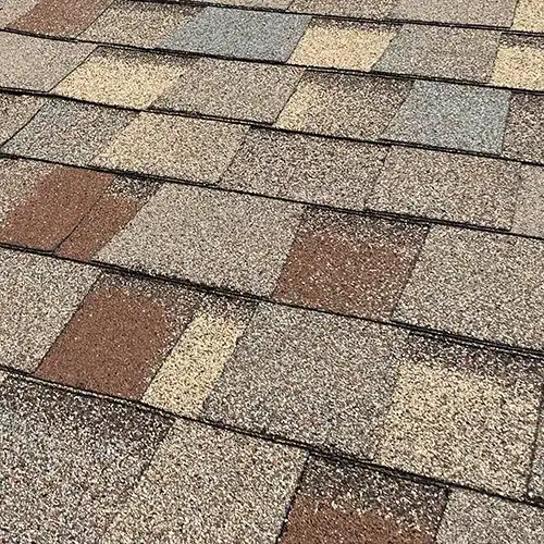 a close-up image of a new asphalt shingle roof on a home in Greeley, Colorado