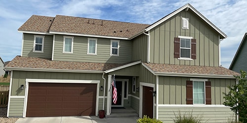 house with new asphalt shingle roof