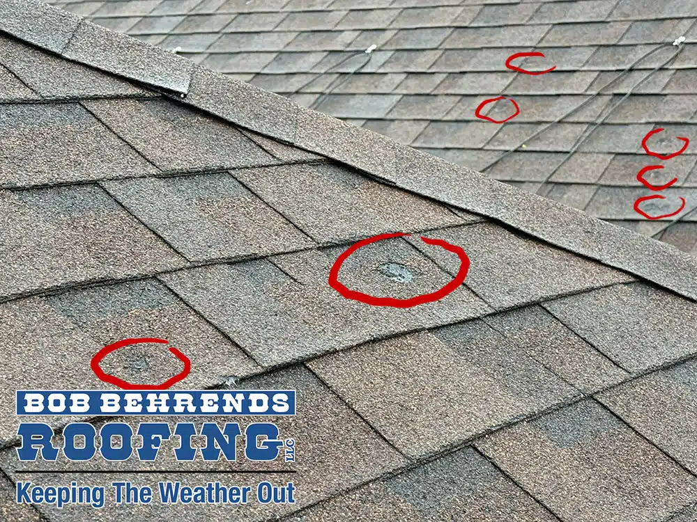 close-up of a hail damaged asphalt shingle roof in Hudson, Colorado